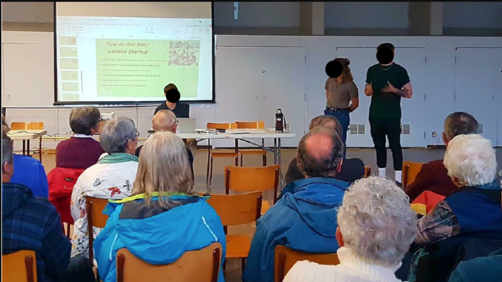 students presenting to a room of people.