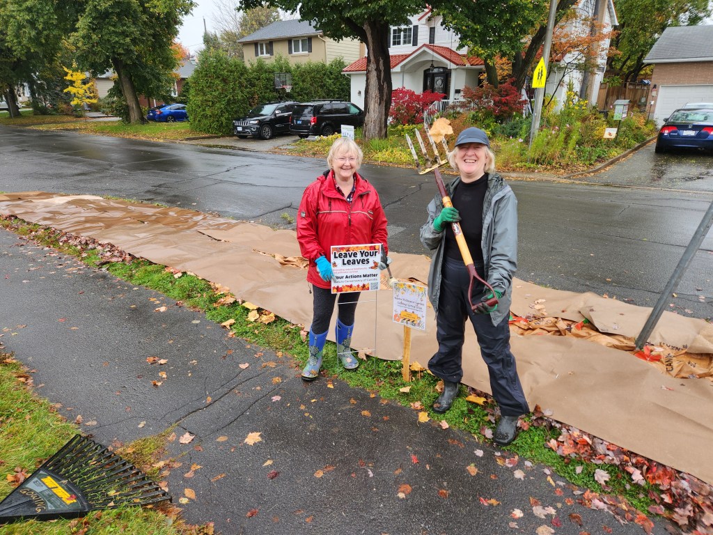 Andrea and Pam posing after laying cardboard.